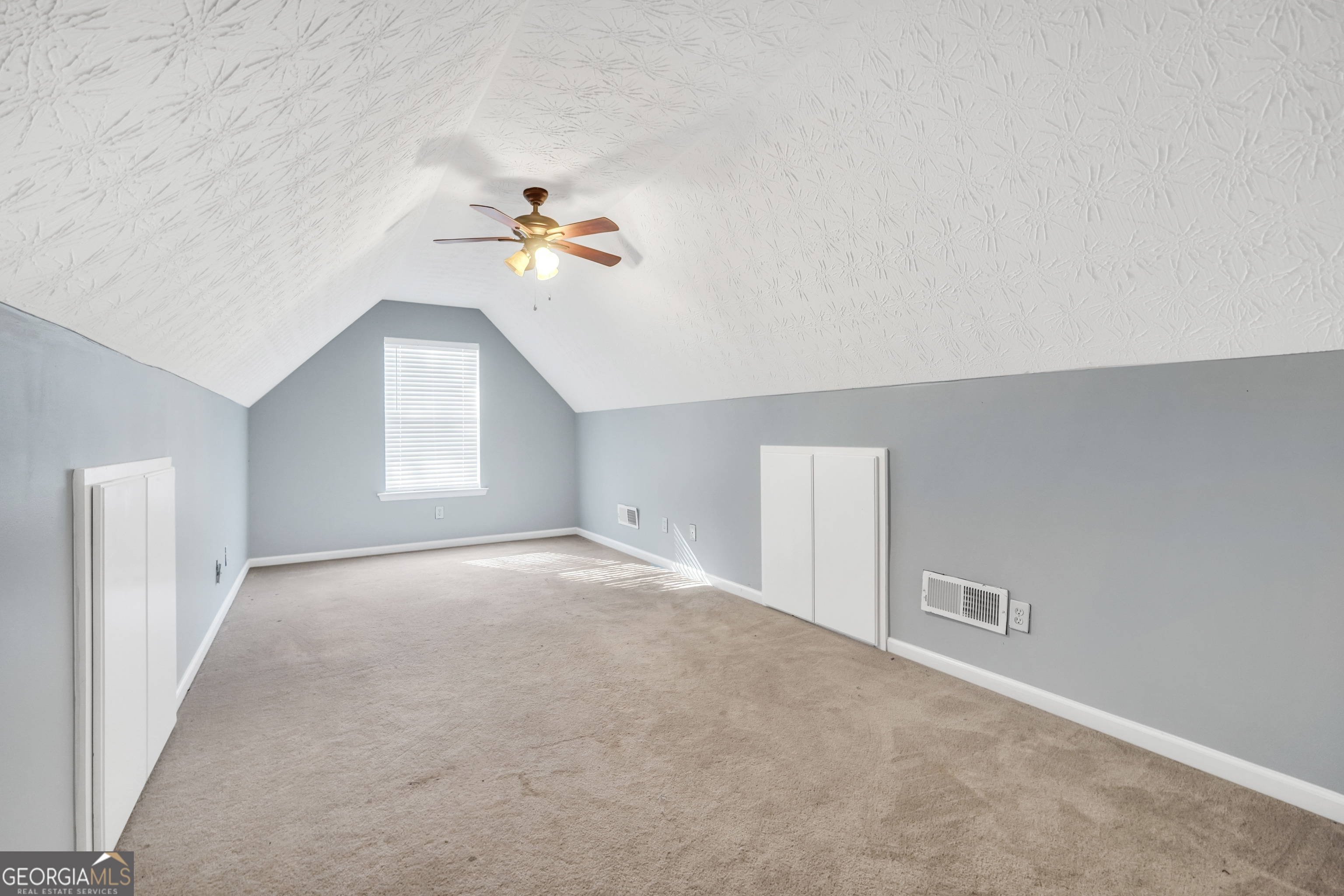610 Kyle Court Locust Grove, GA 30248 - Photo 29 of 35 a view of empty room with a ceiling fan