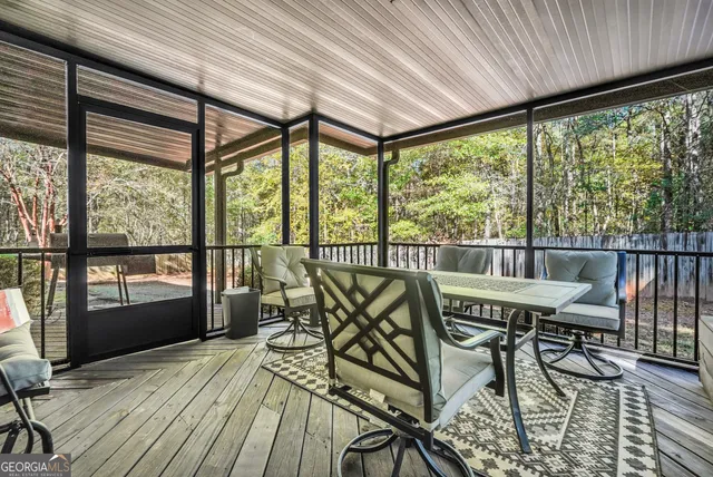 a view of a chairs and table in the balcony