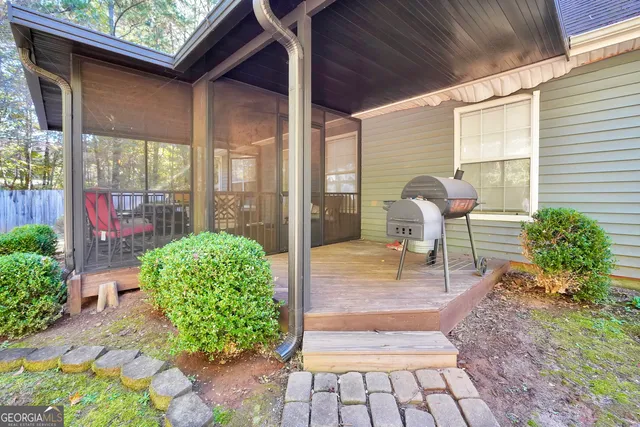 a living room filled with furniture and a potted plant