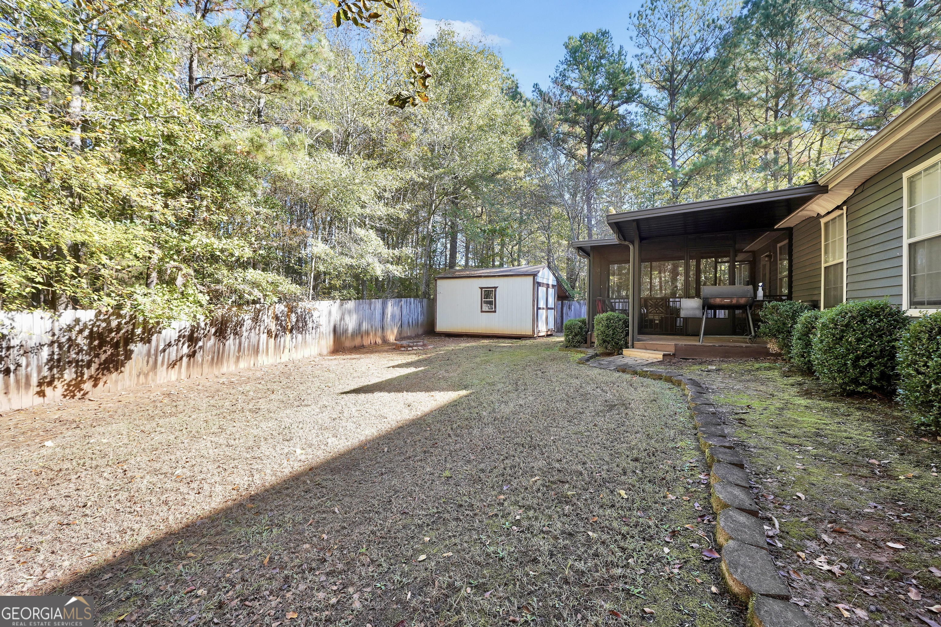 610 Kyle Court Locust Grove, GA 30248 - Photo 34 of 35 a view of a house with a yard and tree