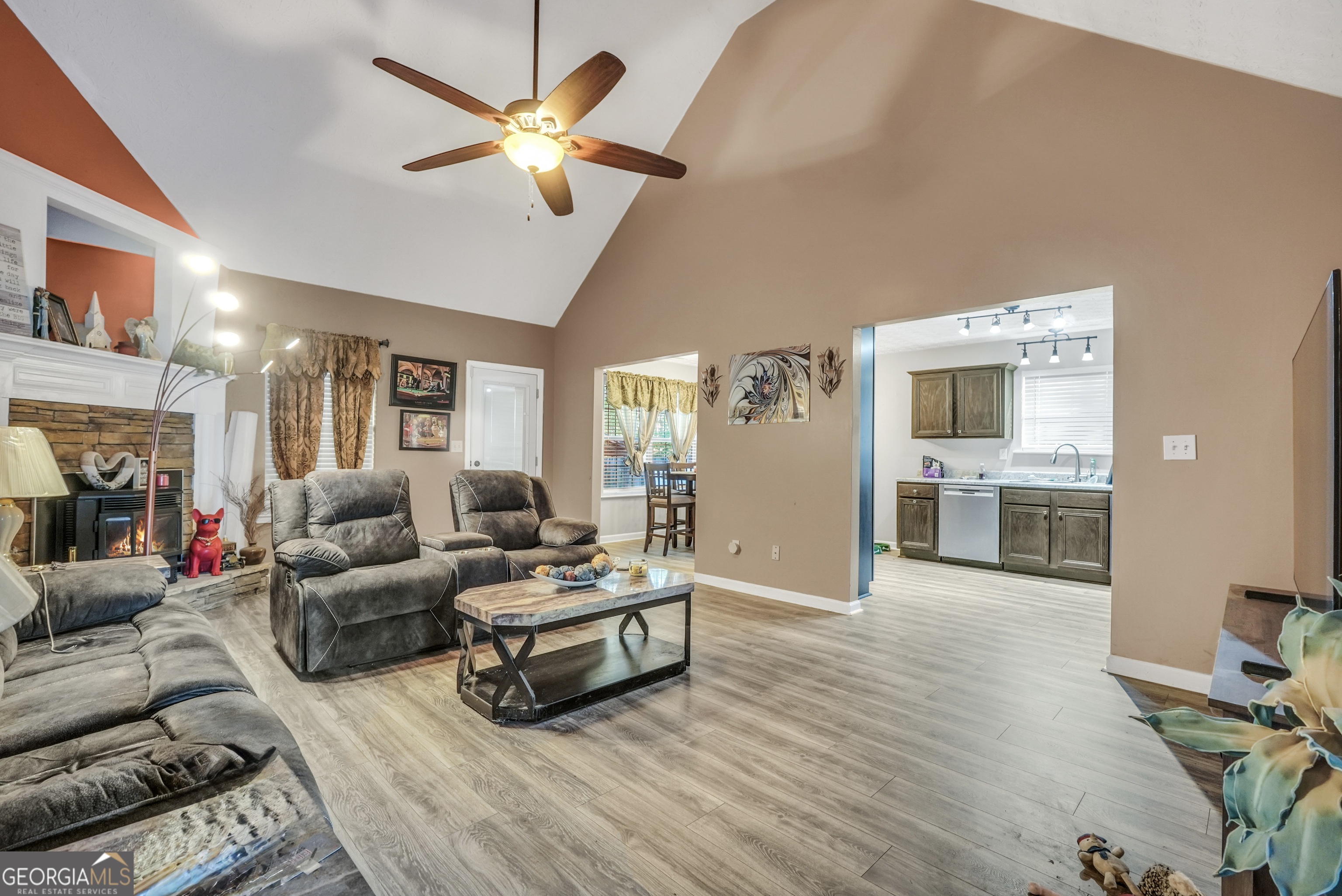 610 Kyle Court Locust Grove, GA 30248 - Photo 9 of 35 a living room with furniture and a flat screen tv
