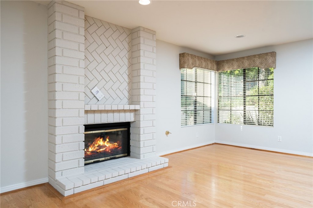 112 Morgan Ranch Road Glendora, CA 91741 - Photo 16 of 58 a view of an empty room with a fireplace and a window