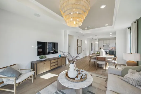 a view of a dining room with furniture and wooden floor