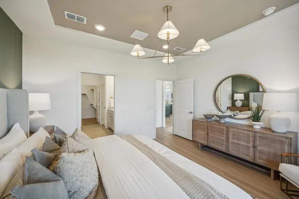 a bathroom with a double vanity sink mirror and shower