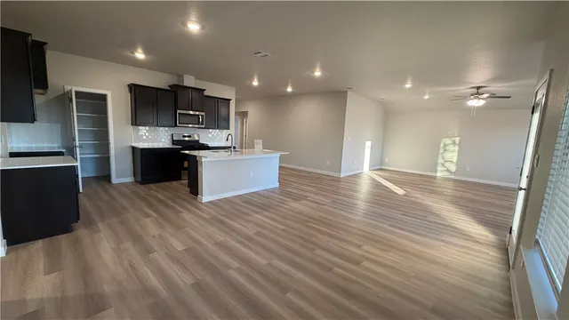 a bathroom with a sink a mirror and a shower
