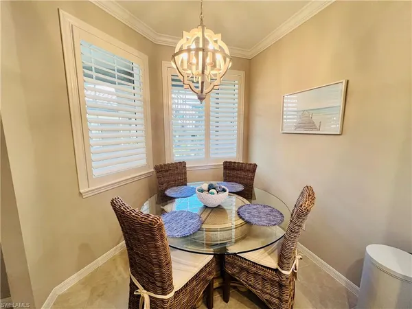 a dining room with furniture and windows