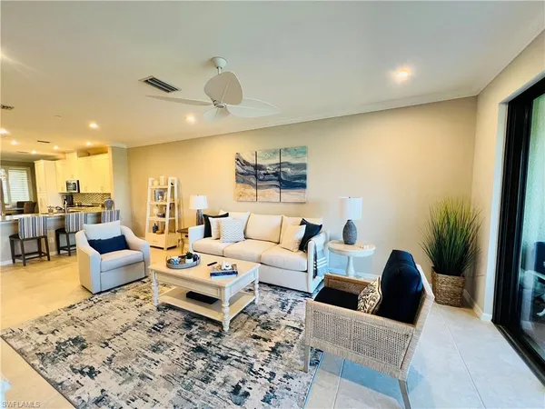 a living room with furniture and a rug