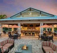 a view of a patio with table and chairs potted plants