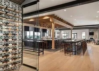 a dining room with furniture and chandelier