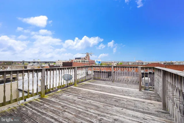 a balcony with wooden floor