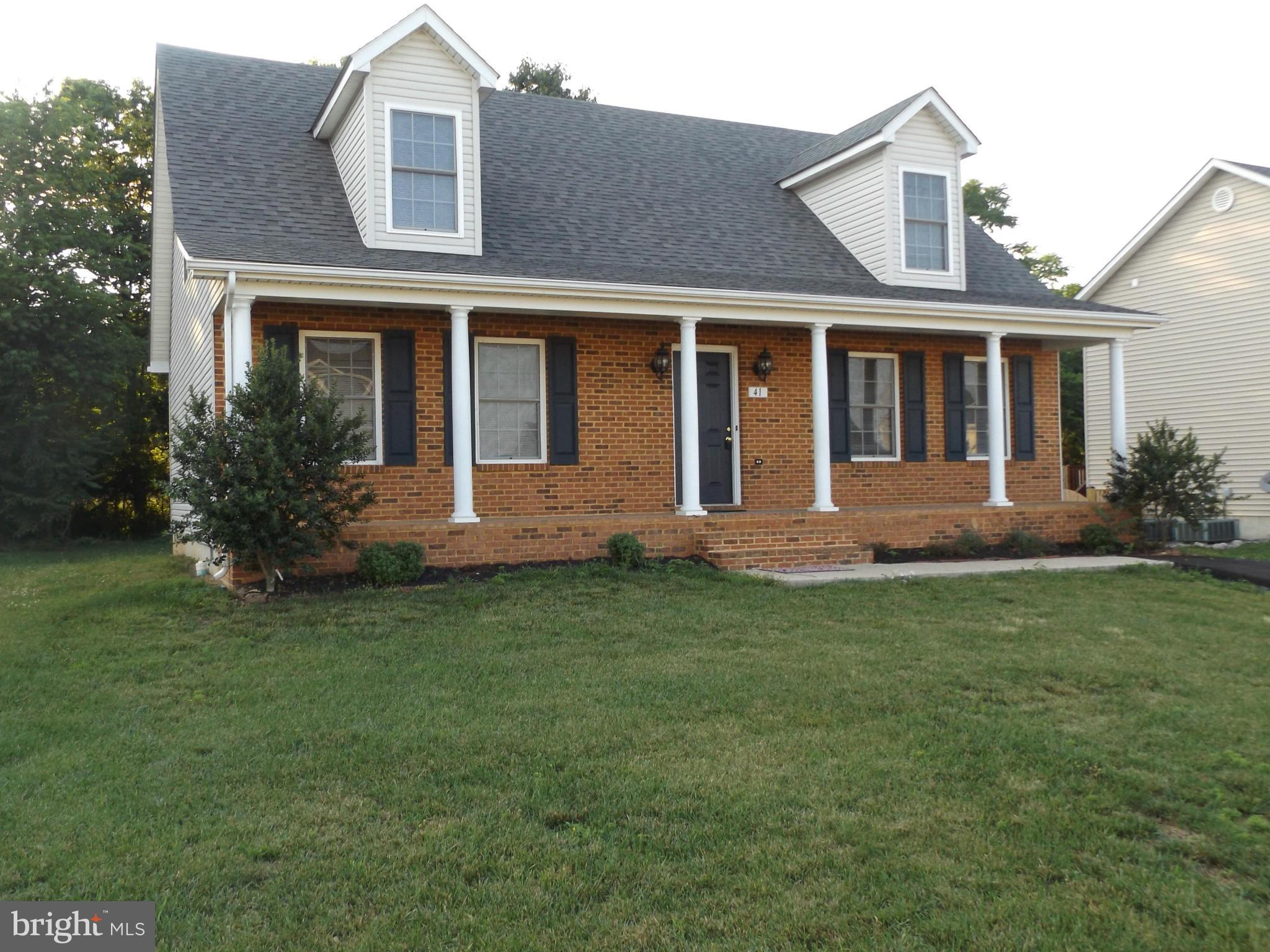 41 Gibson Road Inwood, WV 25428 - Photo 2 of 26 front view of a house with a yard