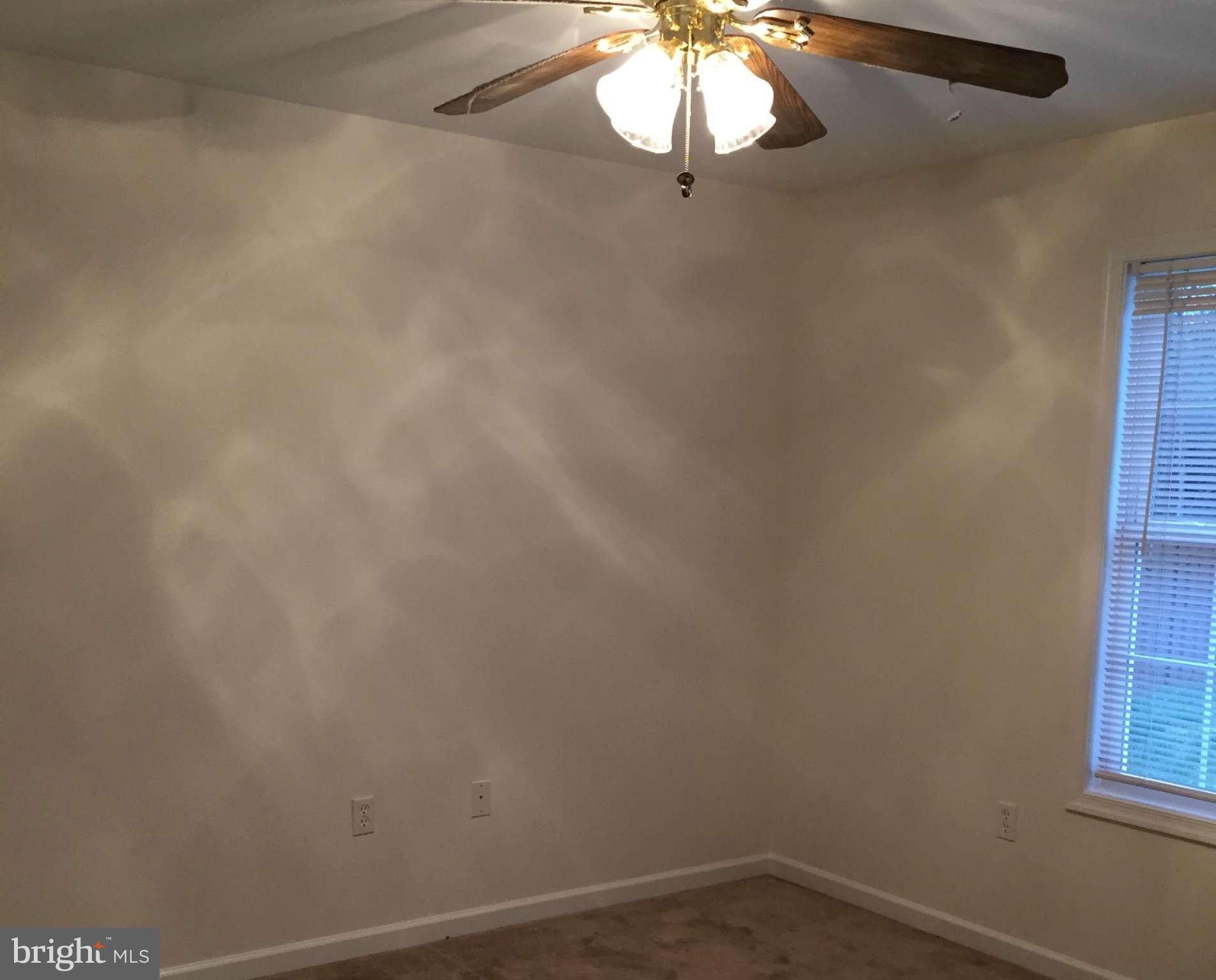 41 Gibson Road Inwood, WV 25428 - Photo 12 of 26 a view of a room with a chandelier fan