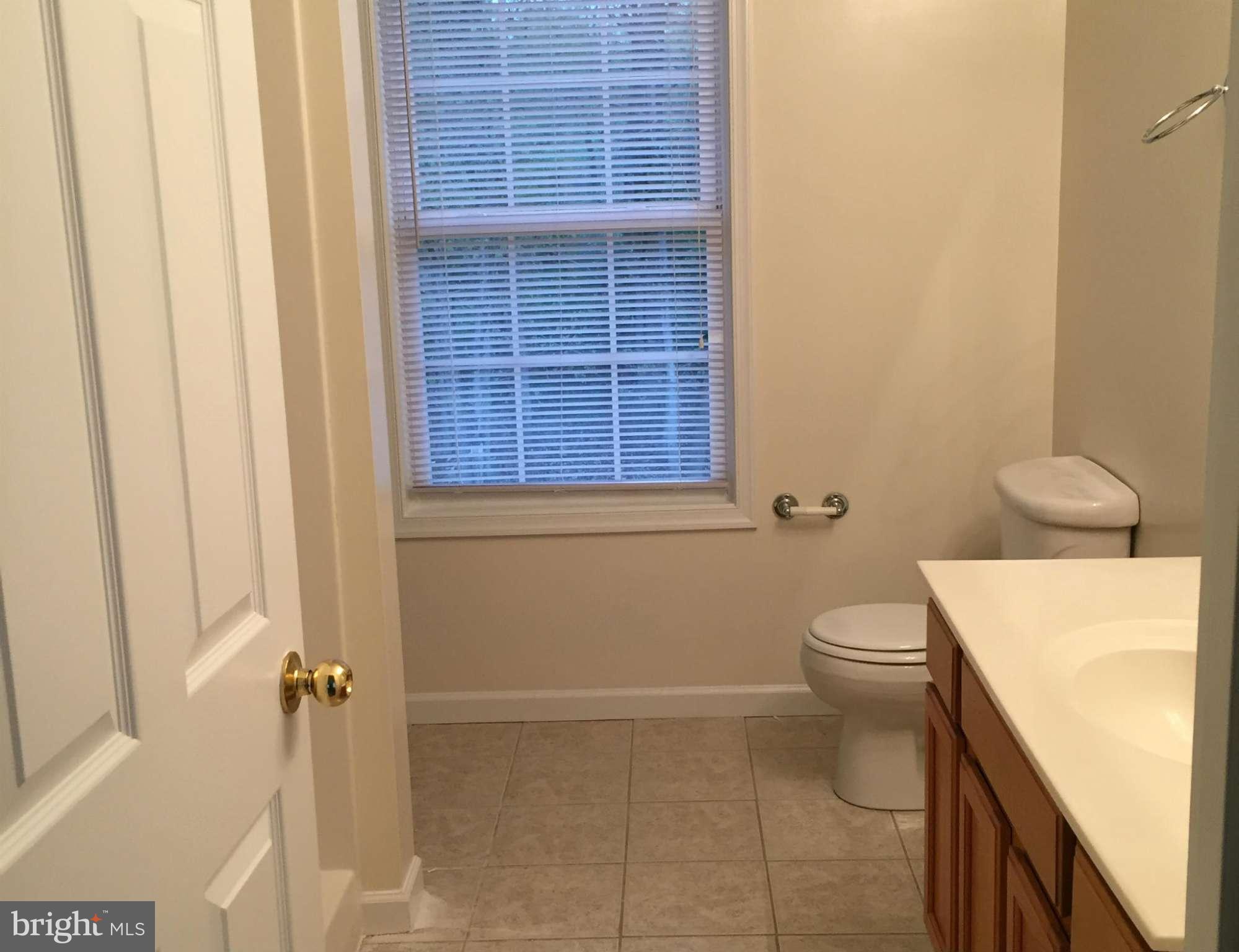 41 Gibson Road Inwood, WV 25428 - Photo 18 of 26 a bathroom with a toilet and a shower
