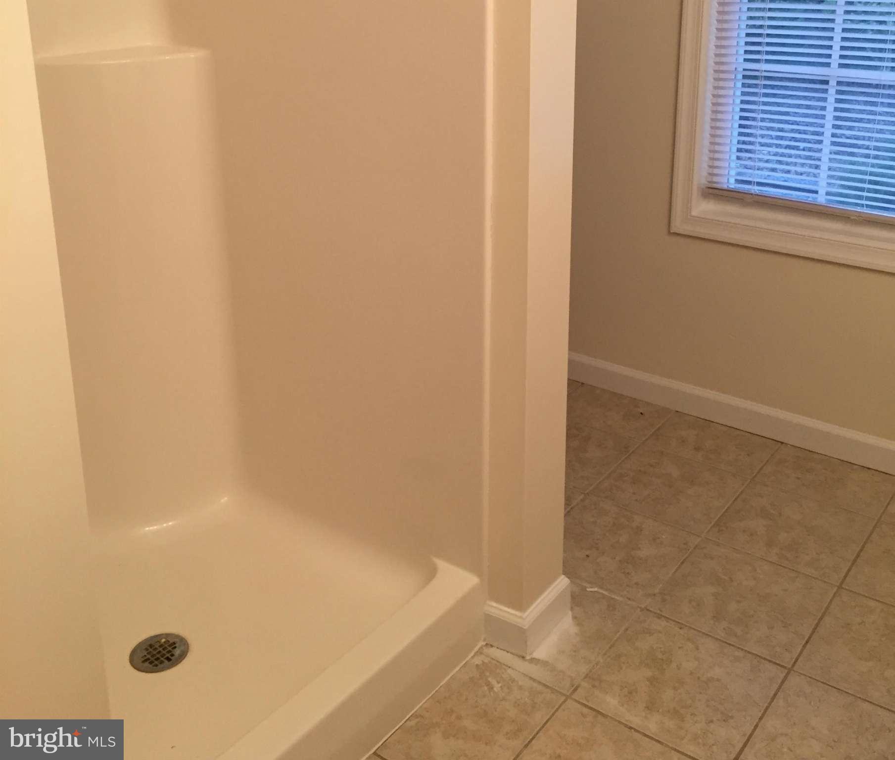 41 Gibson Road Inwood, WV 25428 - Photo 19 of 26 a bathroom with a tub