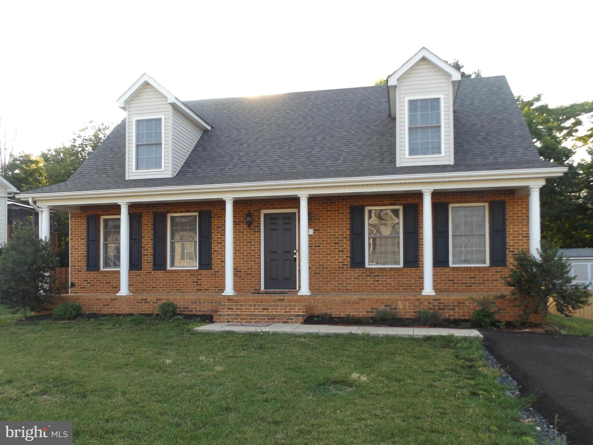 41 Gibson Road Inwood, WV 25428 - Photo 3 of 26 a front view of a house with garden