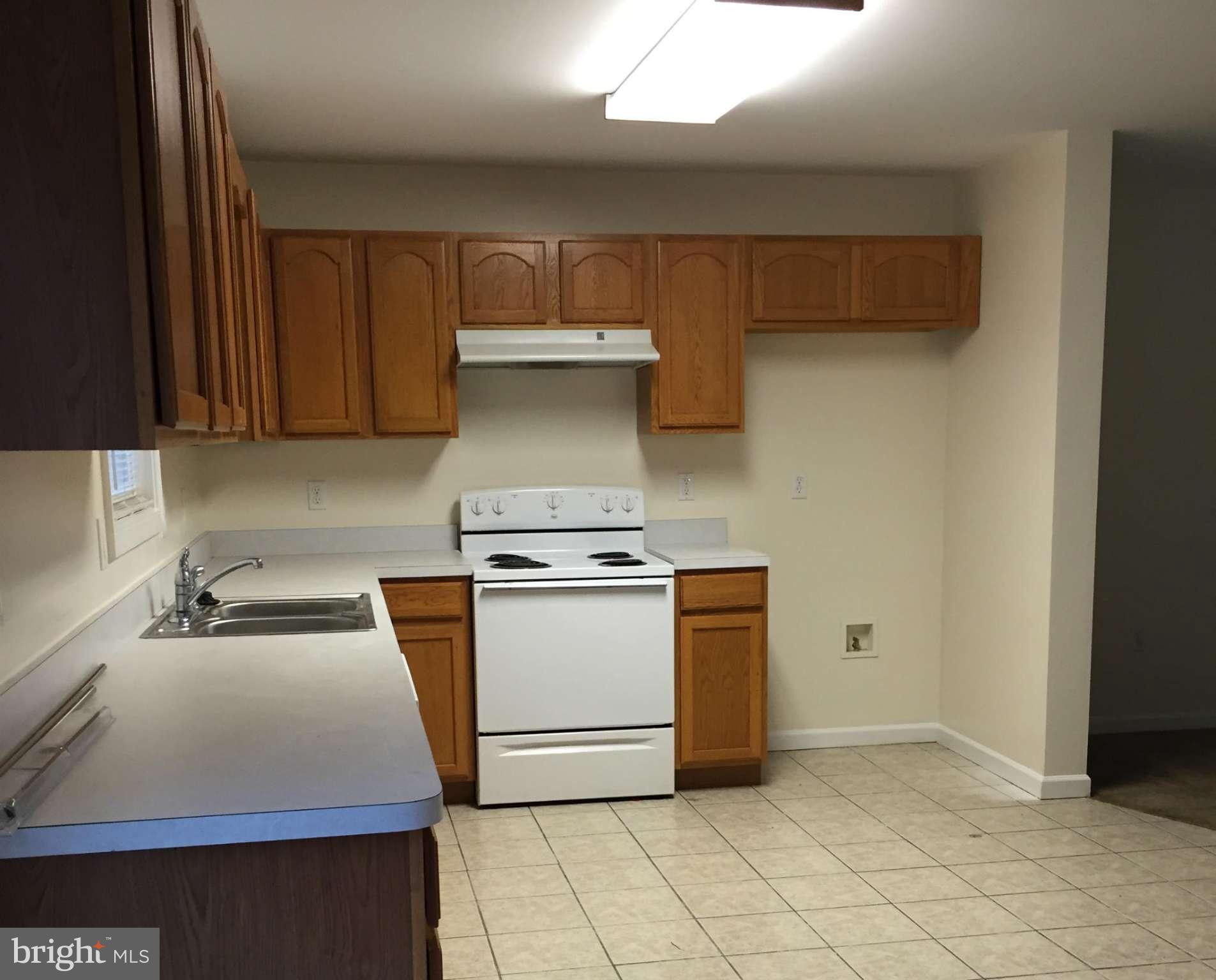 41 Gibson Road Inwood, WV 25428 - Photo 5 of 26 a kitchen with a stove and a cabinets