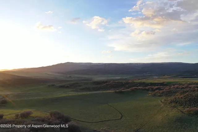 a view of a lake in middle of forest
