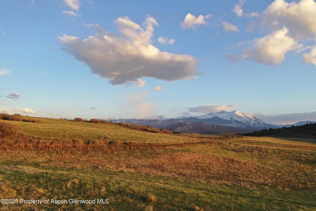 a view of an ocean and mountain