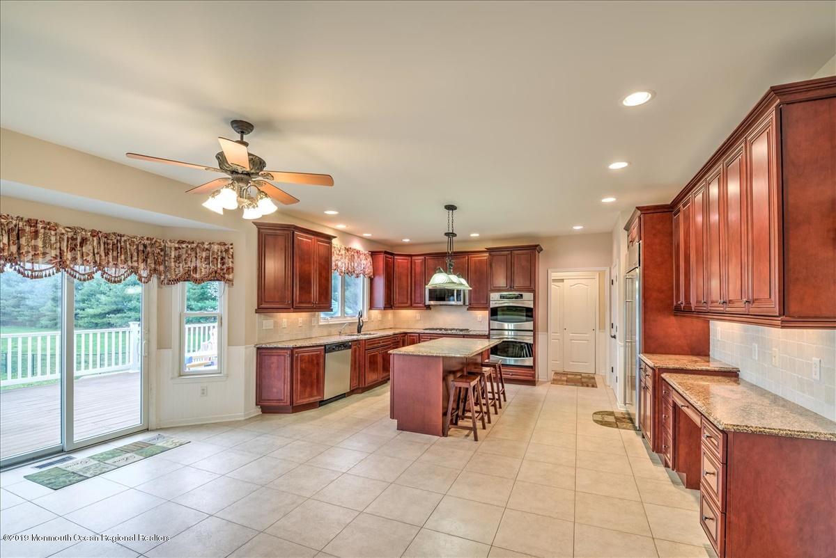 3 Yellow Meetinghouse Road Millstone Township, NJ 08510 - Photo 11 of 29 a large kitchen with a large counter top space appliances and cabinets