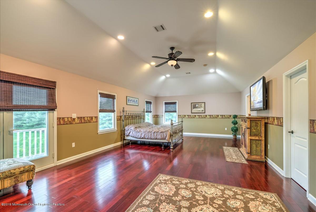 3 Yellow Meetinghouse Road Millstone Township, NJ 08510 - Photo 17 of 29 a living room with furniture and a wooden floor