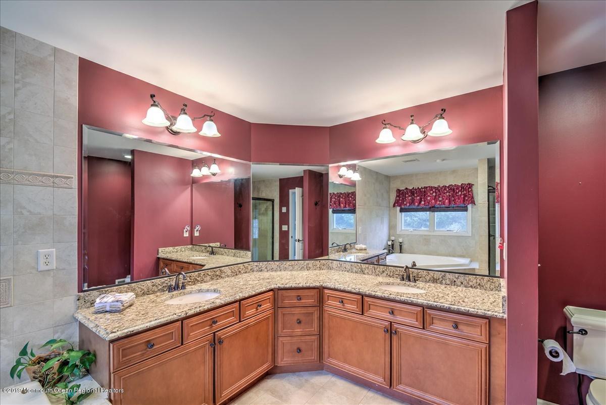 3 Yellow Meetinghouse Road Millstone Township, NJ 08510 - Photo 18 of 29 a bathroom with a sink double vanity and a mirror