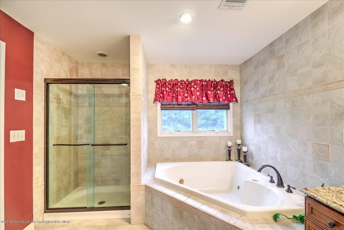 3 Yellow Meetinghouse Road Millstone Township, NJ 08510 - Photo 19 of 29 a bathroom with a bathtub and a shower
