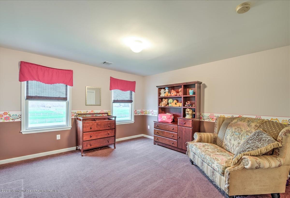 3 Yellow Meetinghouse Road Millstone Township, NJ 08510 - Photo 21 of 29 a living room with furniture and a window