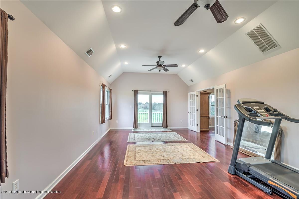 3 Yellow Meetinghouse Road Millstone Township, NJ 08510 - Photo 24 of 29 a view of a livingroom with wooden floor and staircase