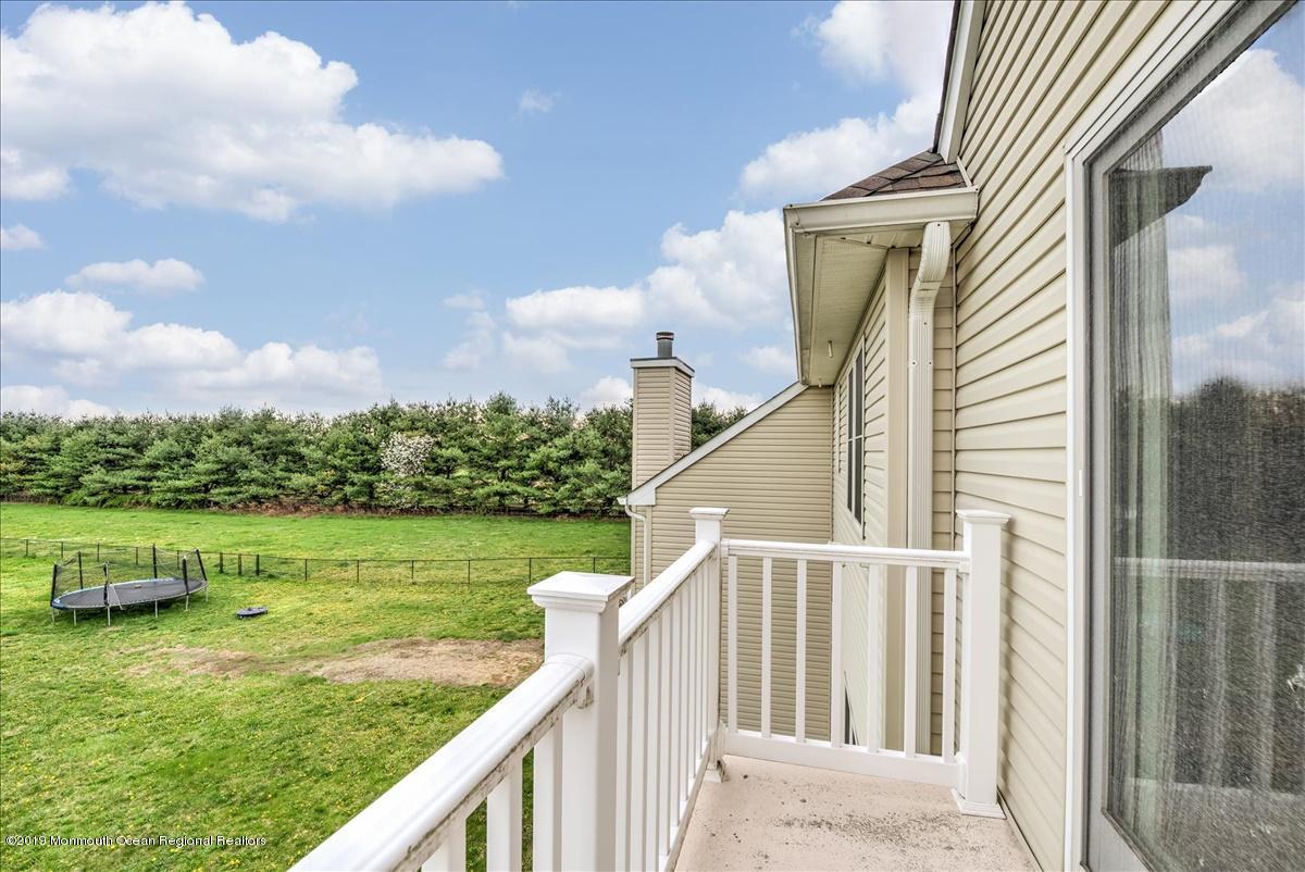3 Yellow Meetinghouse Road Millstone Township, NJ 08510 - Photo 25 of 29 a balcony with an ocean view