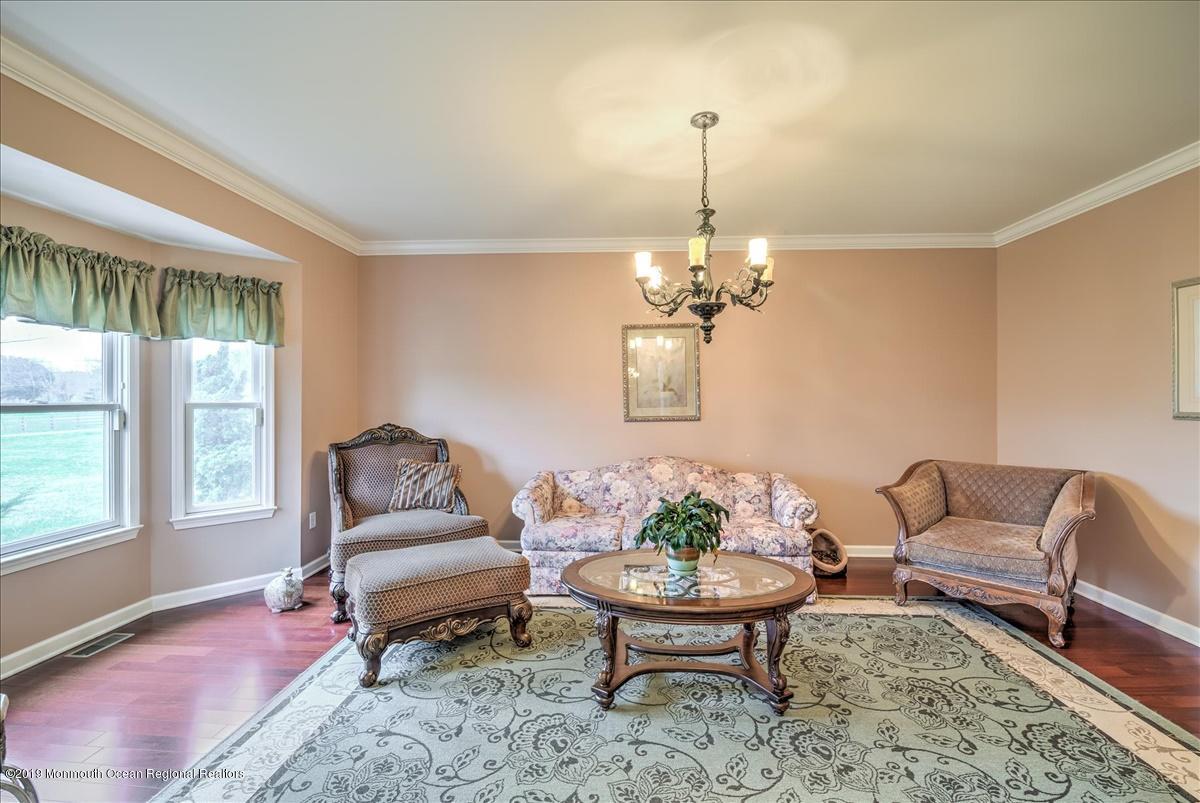 3 Yellow Meetinghouse Road Millstone Township, NJ 08510 - Photo 4 of 29 a living room with furniture chandelier and a window