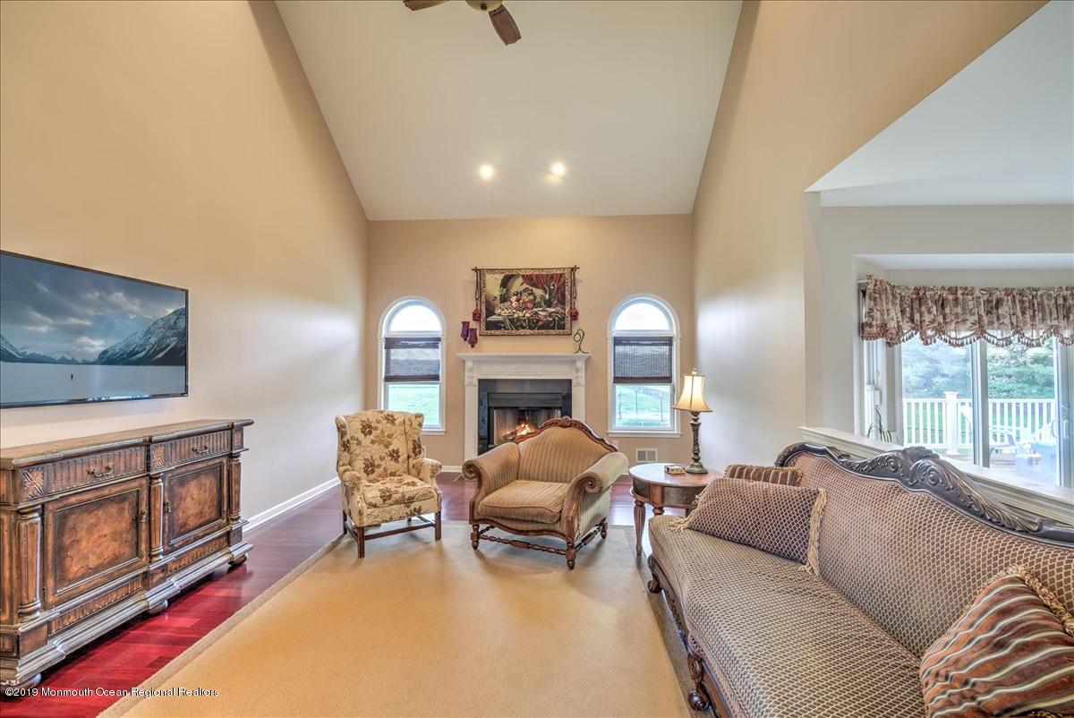 3 Yellow Meetinghouse Road Millstone Township, NJ 08510 - Photo 5 of 29 a living room with furniture and a fireplace