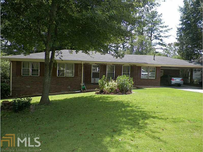 669 Concord Road Southwest, Unit 4 Smyrna, GA 30082 - Photo 1 of 1 a view of a house with a yard