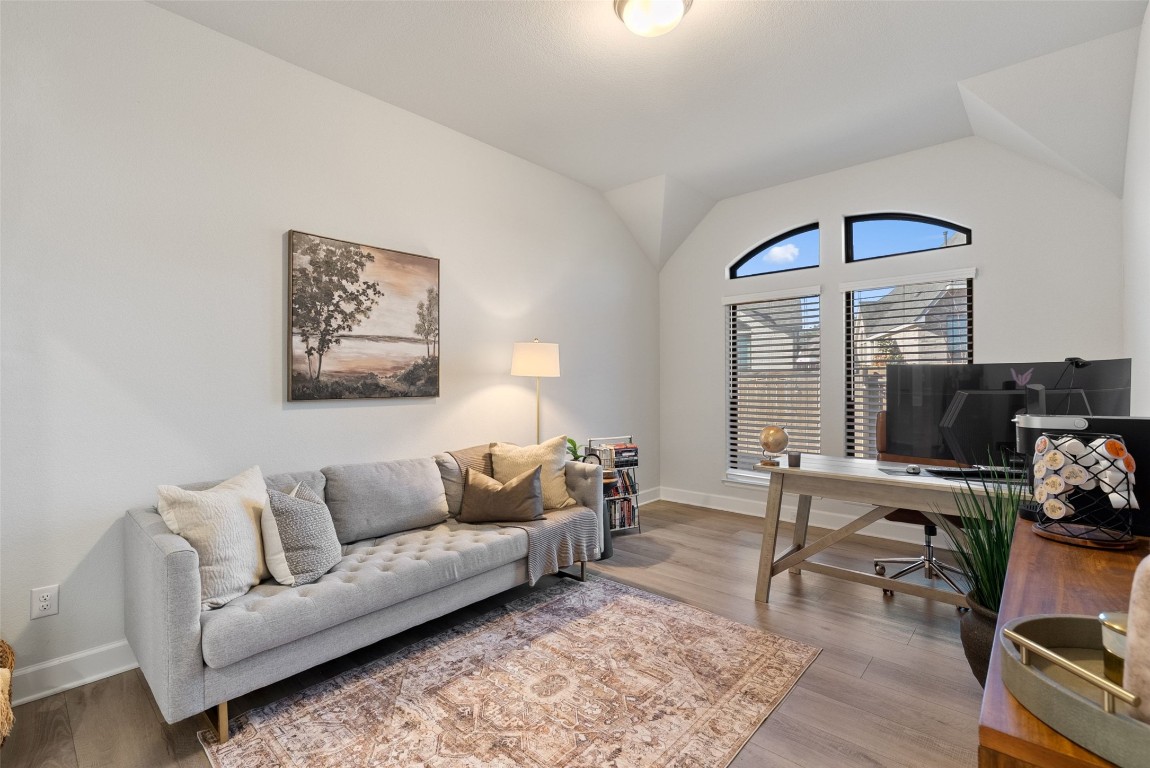 321 Allegheny Way Kyle, TX 78640 - Photo 19 of 40 Home office featuring wood finished floors and lofted ceiling