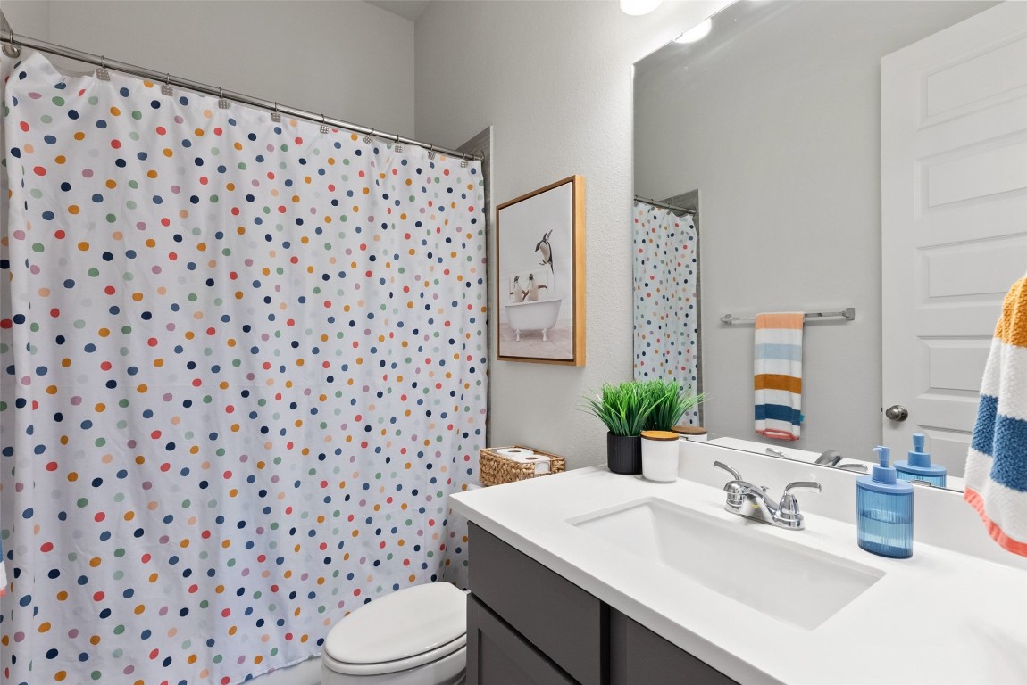 321 Allegheny Way Kyle, TX 78640 - Photo 24 of 40 Full bath featuring vanity and curtained shower