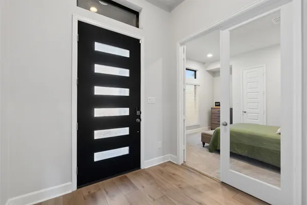 a view of bedroom with a bed and a dresser