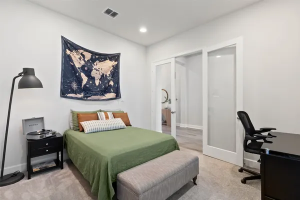 a bedroom with a bed and furniture