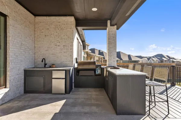 a kitchen with a sink and a stove top oven