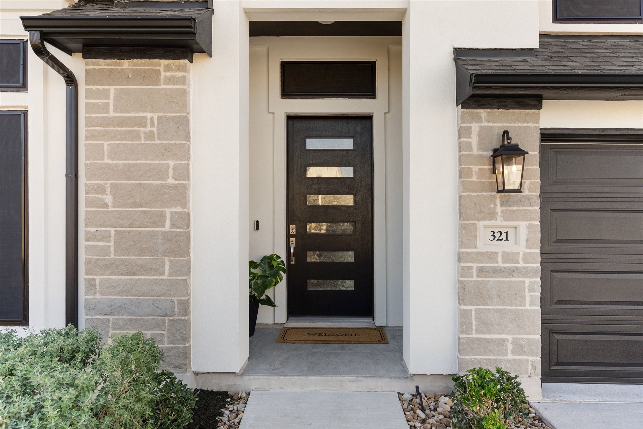 321 Allegheny Way Kyle, TX 78640 - Photo 4 of 40 a view of front door and potted plants