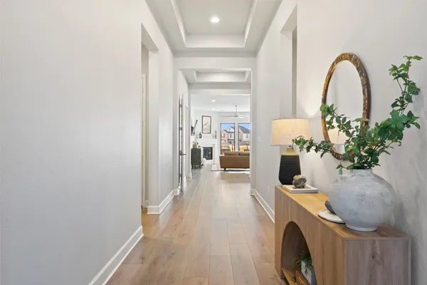 a view of a kitchen from a hallway