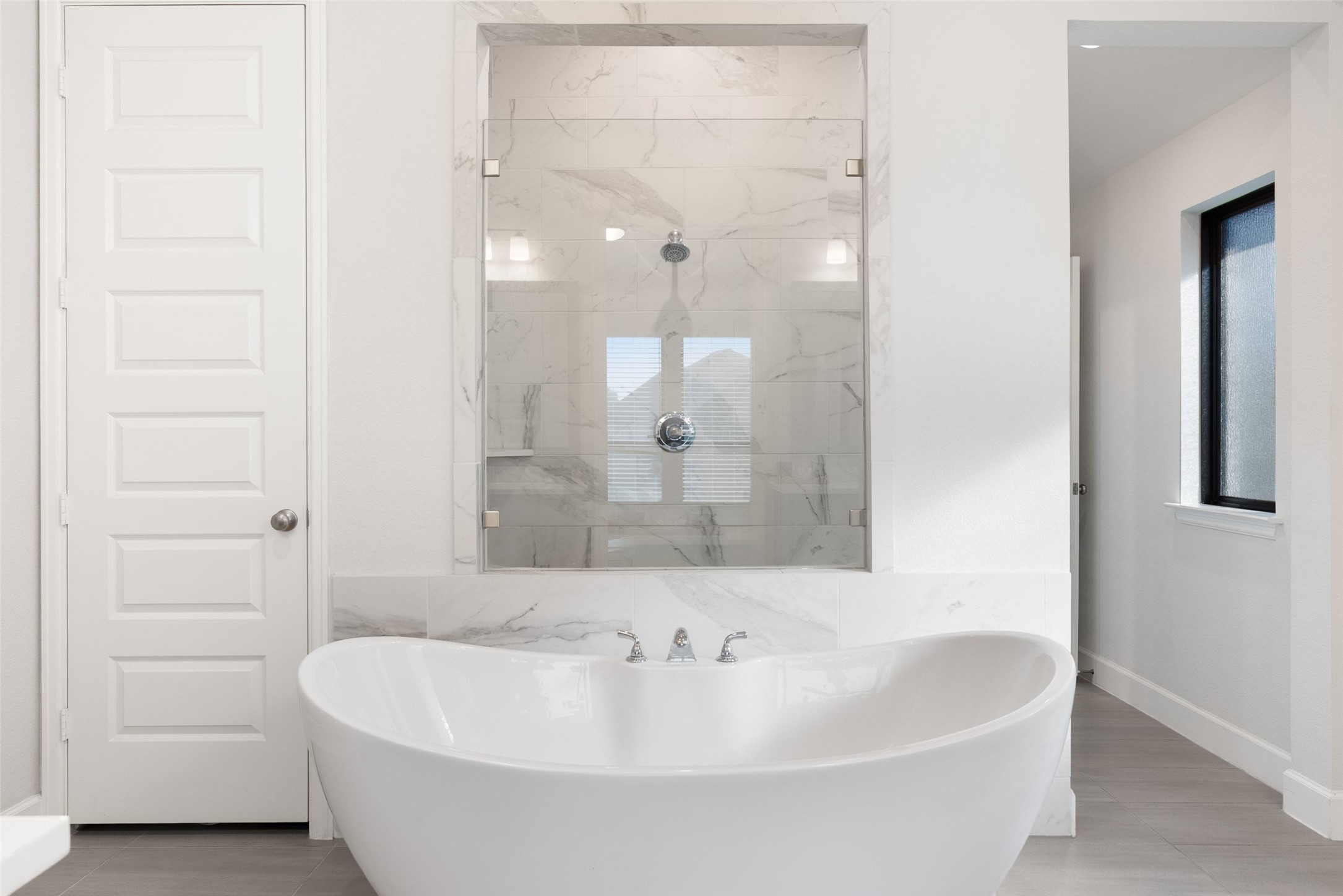321 Allegheny Way Kyle, TX 78640 - Photo 8 of 40 a bathroom with a bathtub and a shower