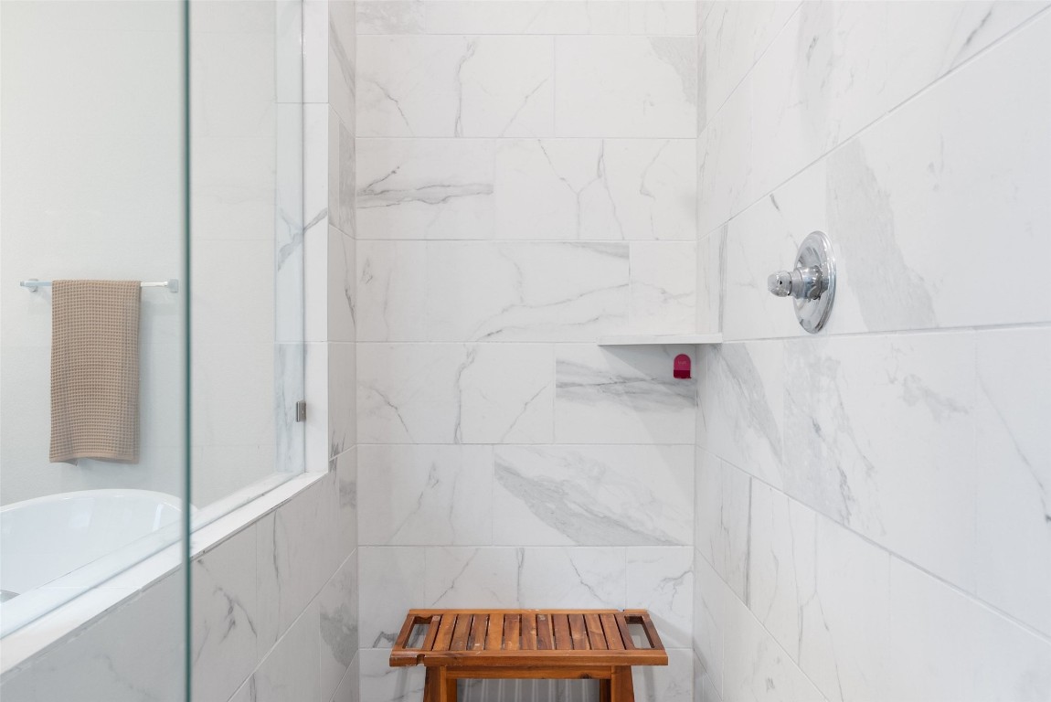 321 Allegheny Way Kyle, TX 78640 - Photo 10 of 40 Bathroom featuring a marble finish shower and a tub to relax in