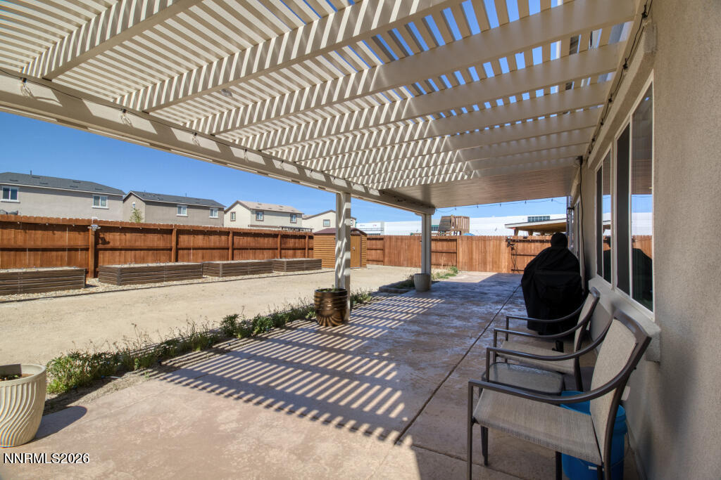8957 Buffalo Grove Drive Reno, NV 89506 - Photo 43 of 59 a view of a porch with wooden floor