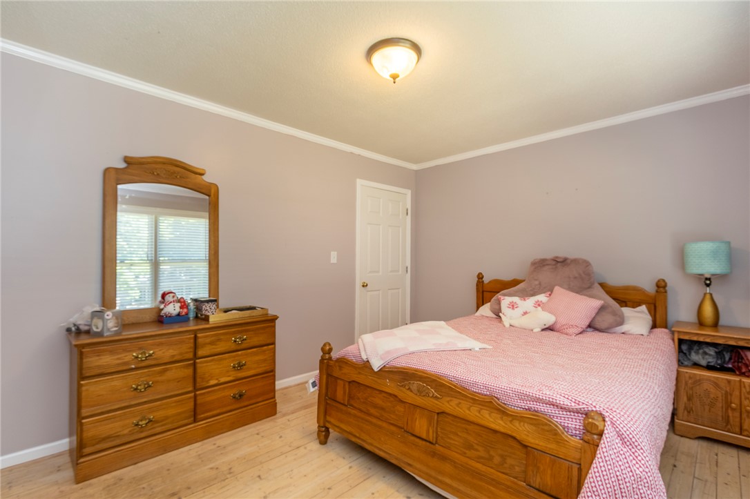 151 Hannah Circle Anderson, SC 29621 - Photo 25 of 46 This cozy bedroom features light wooden flooring and ample natural light, creating a bright and airy atmosphere.