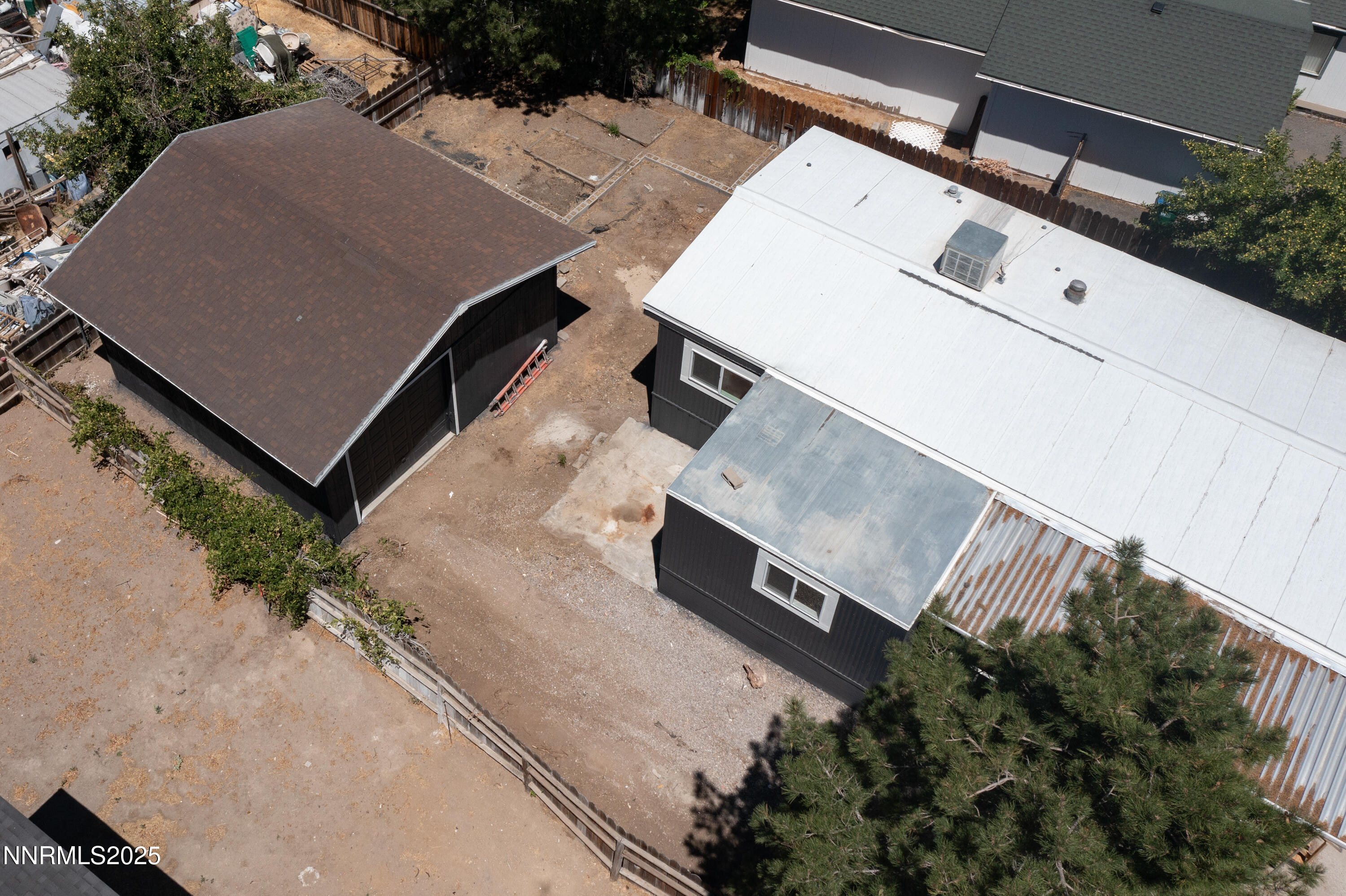 16385 Rhyolite Circle Reno, NV 89521 - Photo 44 of 50 an aerial view of a house with a yard and wooden fence