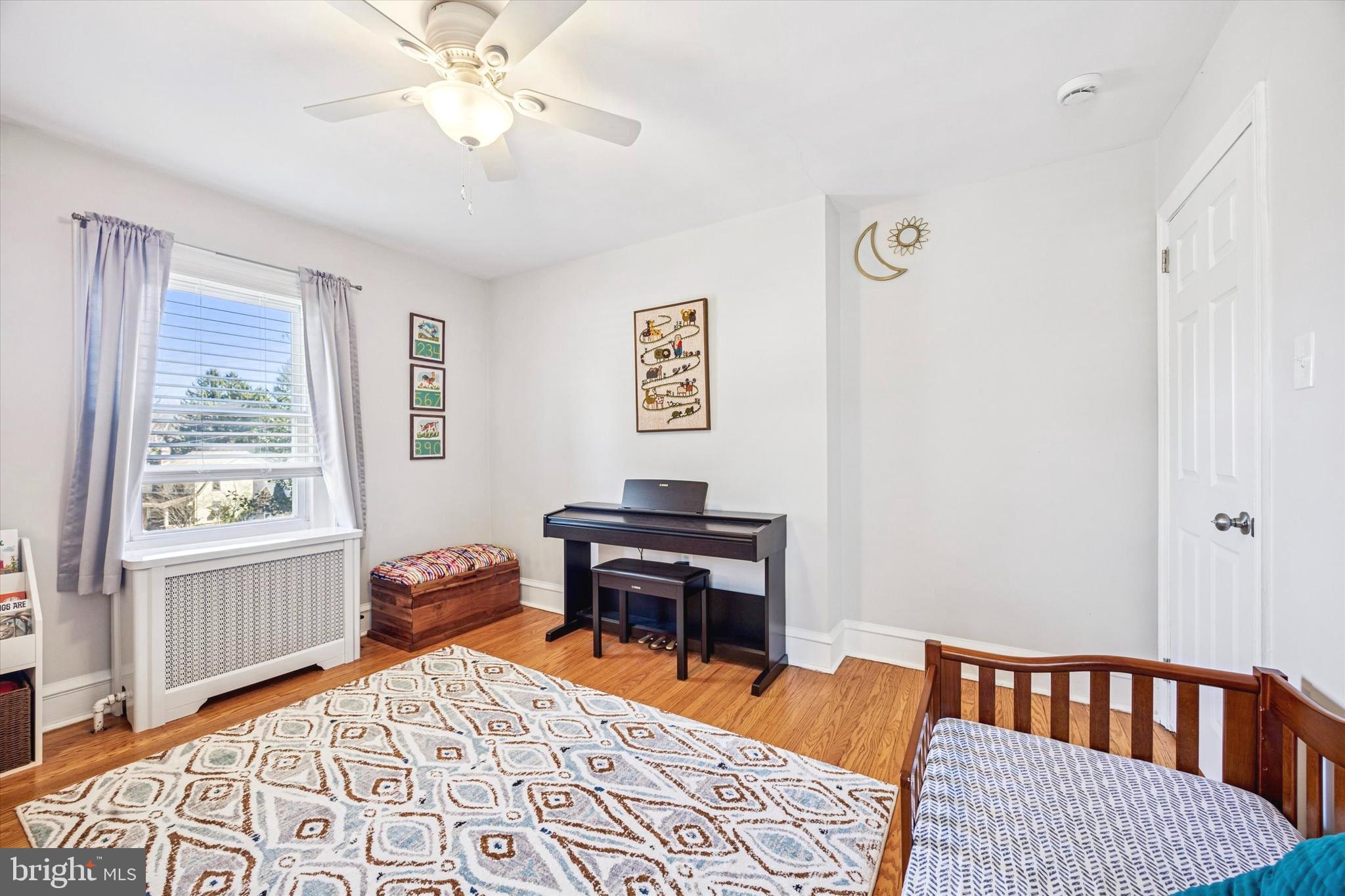 507 East Ridley Avenue Ridley Park, PA 19078 - Photo 11 of 18 a bedroom with a bed and wooden floor
