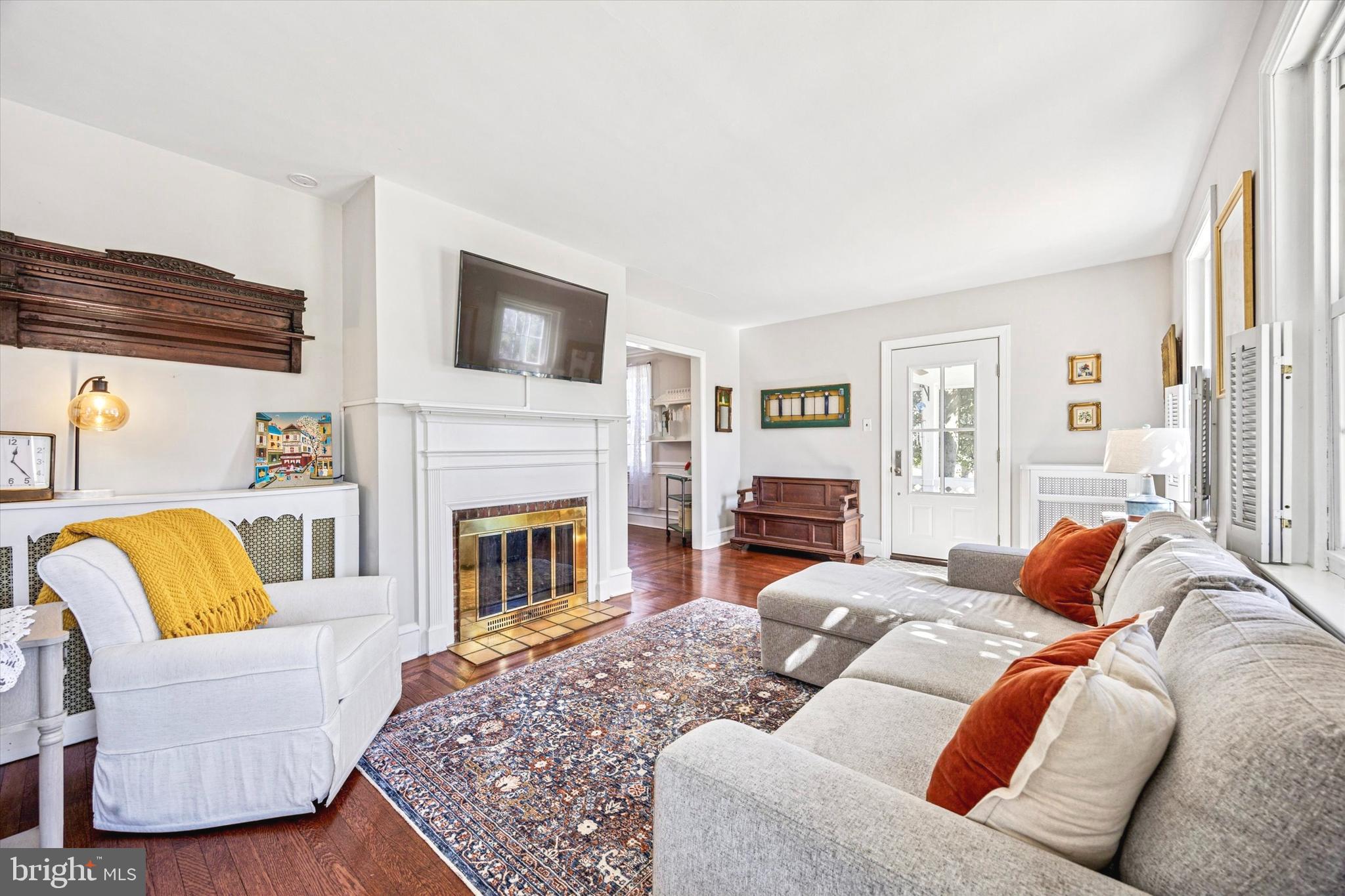 507 East Ridley Avenue Ridley Park, PA 19078 - Photo 5 of 18 a living room with furniture fireplace and a flat screen tv