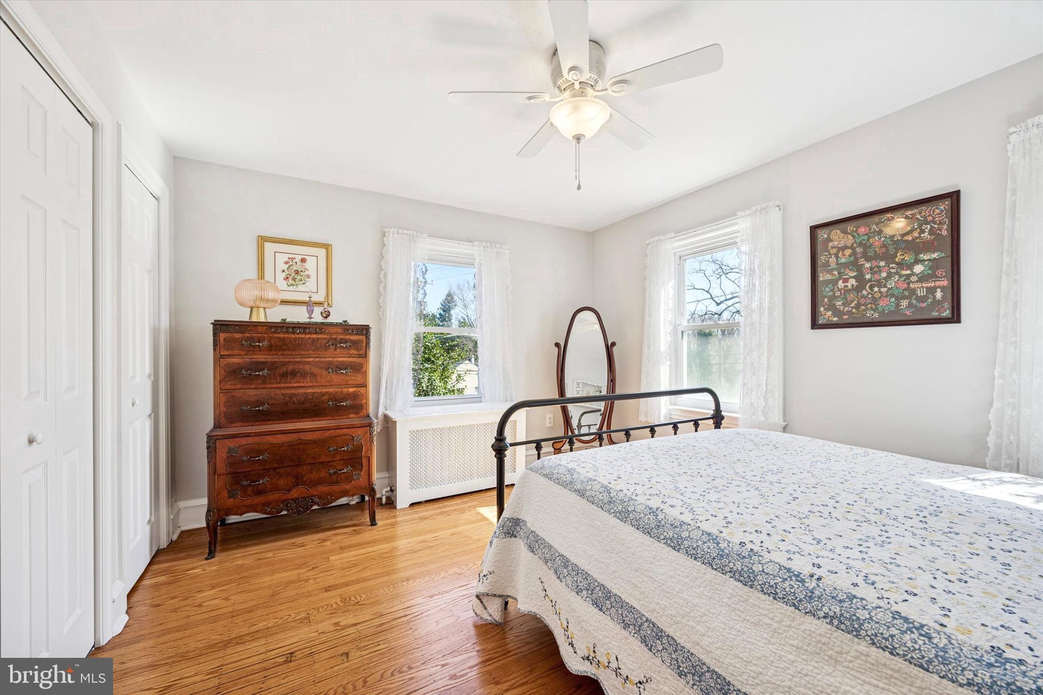 507 East Ridley Avenue Ridley Park, PA 19078 - Photo 8 of 18 a bedroom with a bed a chandelier and a window