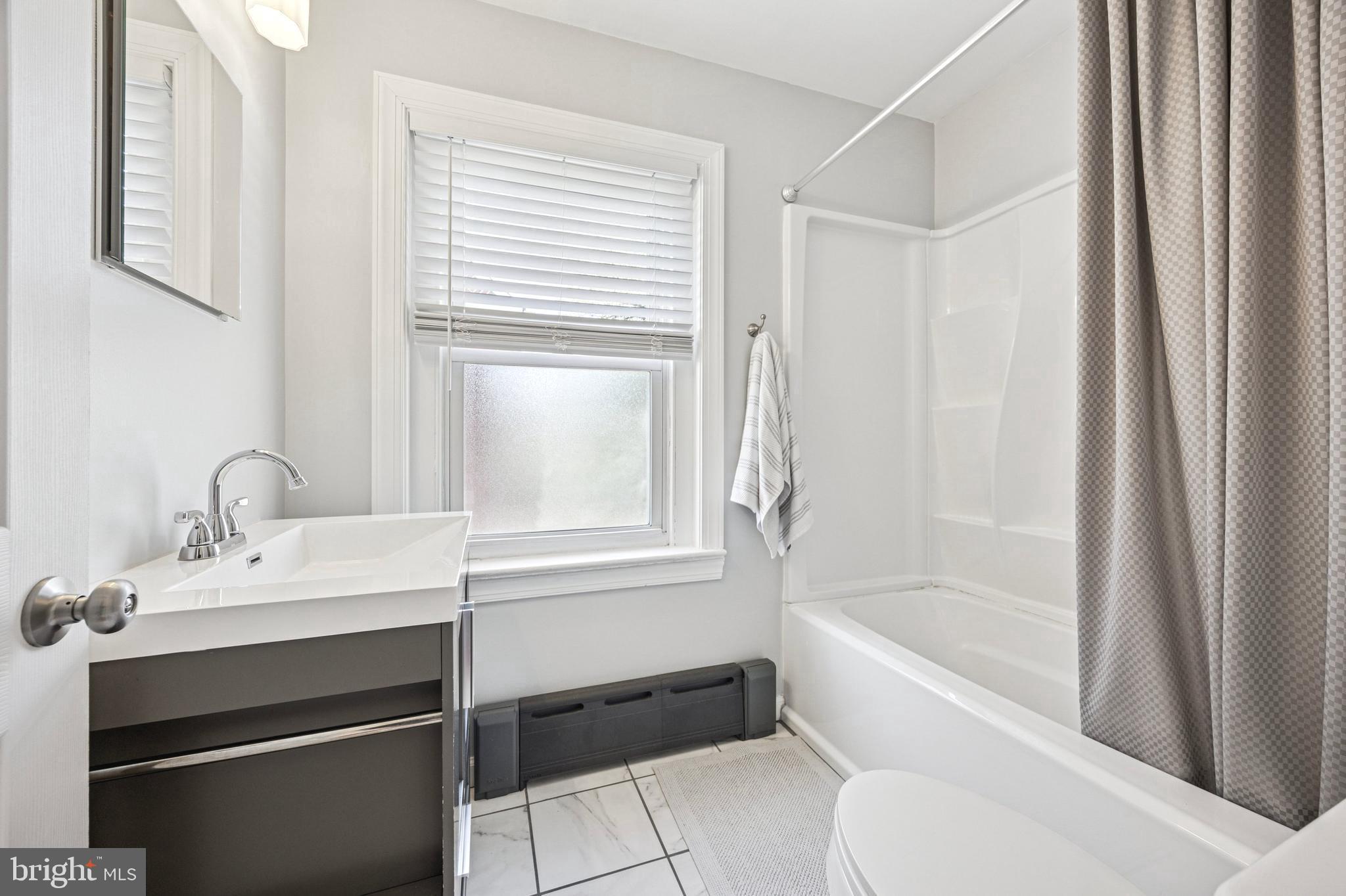 507 East Ridley Avenue Ridley Park, PA 19078 - Photo 9 of 18 a bathroom with a bathtub and a sink