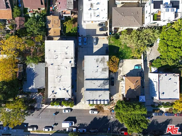 an aerial view of residential houses with outdoor space
