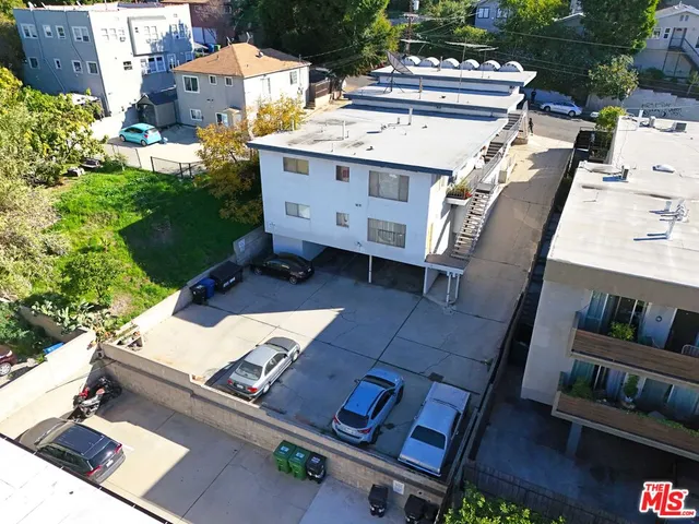 a view of cars parked in front of building